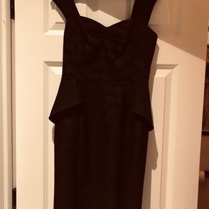 Black fitted cocktail dress with peplum